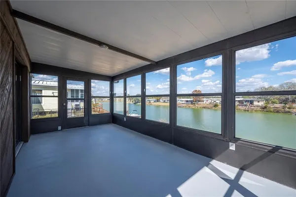 a view of an empty room with a large window