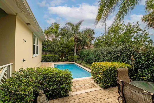 a view of a backyard with sitting area