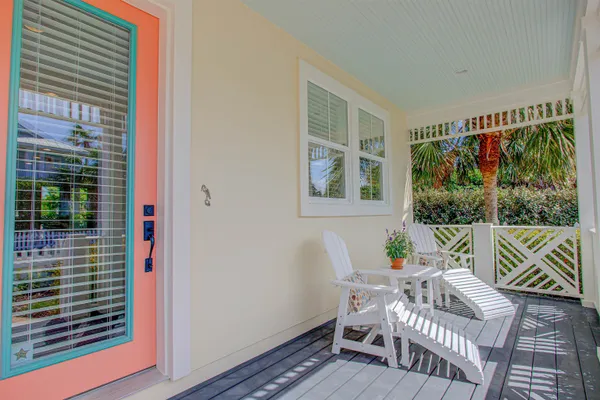 a view of a hallway with furniture and stairs
