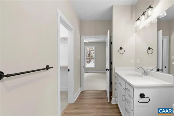 a bathroom with a sink and mirror