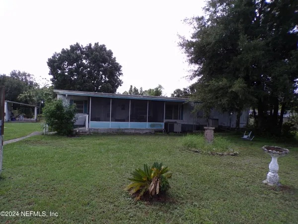 a view of a backyard with furniture