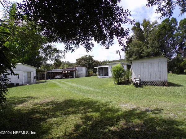 a view of a backyard with a garden