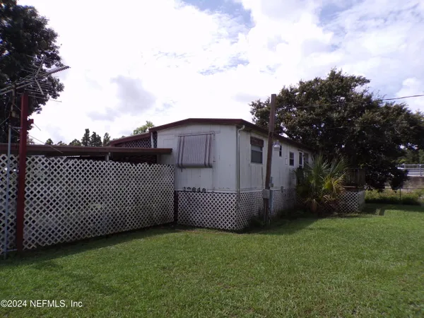 a view of a lake with a yard