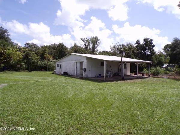 a backyard of a house with lots of green space