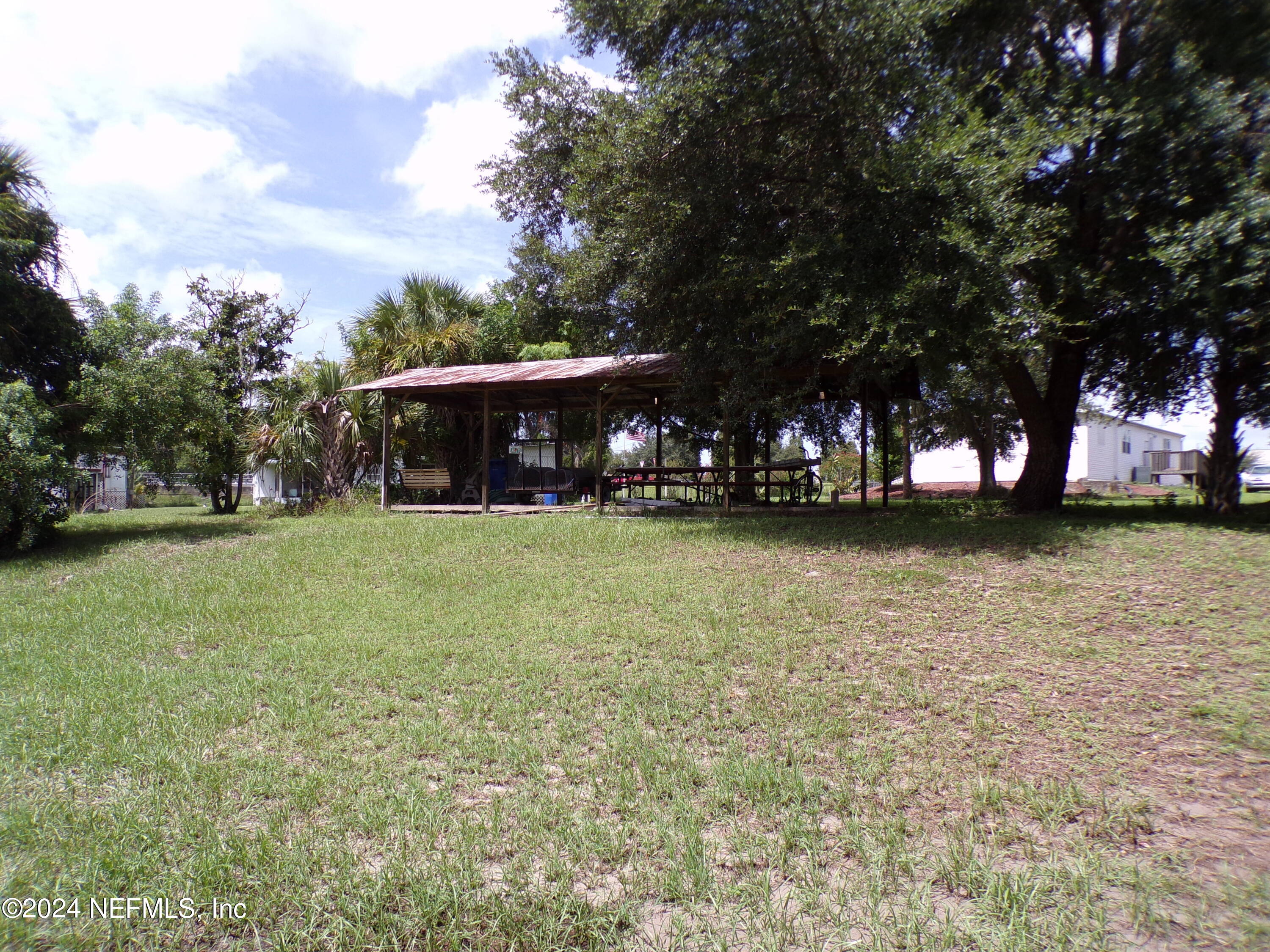 10642 East Bay Road Gibsonton, FL 33534 - Photo 27 of 32 a view of house with outdoor space