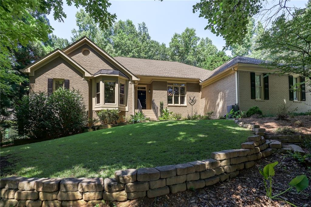 a front view of a house with garden