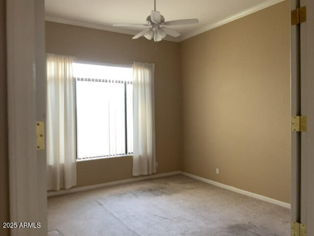 4843 East Estevan Road Phoenix, AZ 85054 - Photo 10 of 10 an empty room with windows and fan