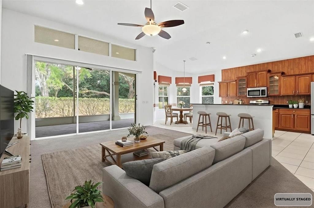 1683 North Shadowview Path Hernando, FL 34442 - Photo 16 of 56 a living room with furniture and a large window