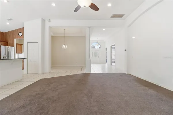 a kitchen with stainless steel appliances a sink stove and cabinets