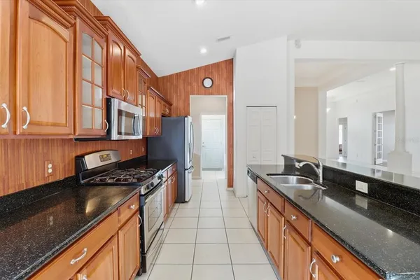 a close view of a sink and dishwasher in kitchen