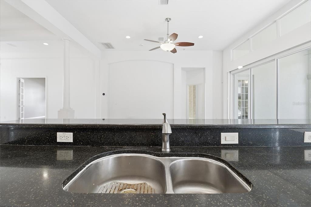1683 North Shadowview Path Hernando, FL 34442 - Photo 23 of 56 a close view of a sink and dishwasher in kitchen