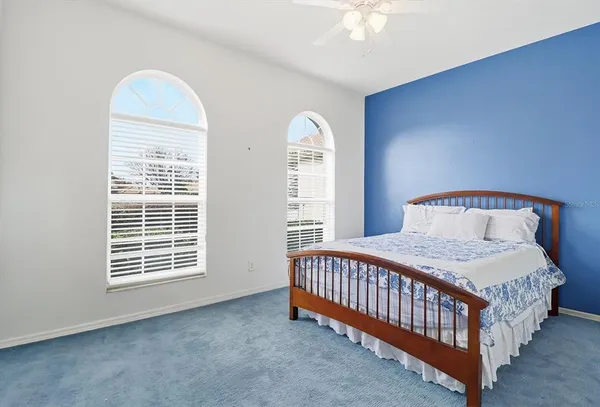 an empty room with a window and wooden floor