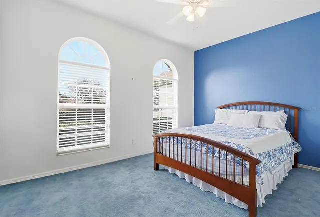 an empty room with a window and wooden floor