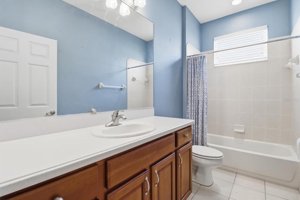 1683 North Shadowview Path Hernando, FL 34442 - Photo 27 of 56 a bathroom with a sink a toilet and shower