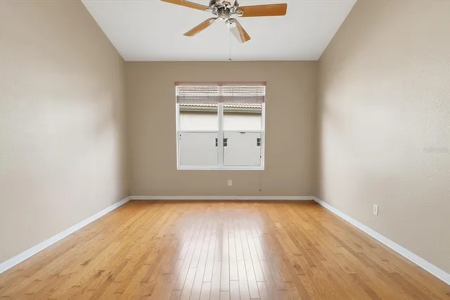 an empty room with windows and closet