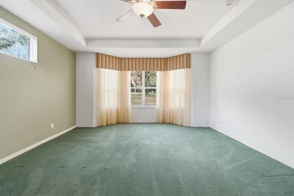 a bathroom with a sink a vanity a mirror and a bathtub
