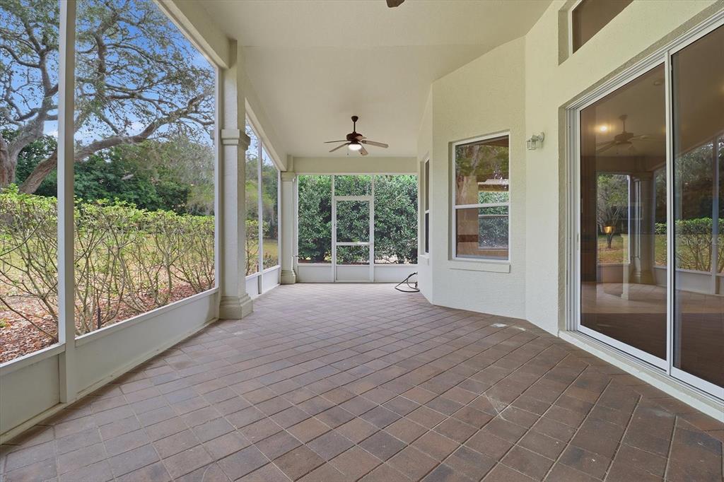 1683 North Shadowview Path Hernando, FL 34442 - Photo 39 of 56 a view of an empty room with a large window and wooden floor