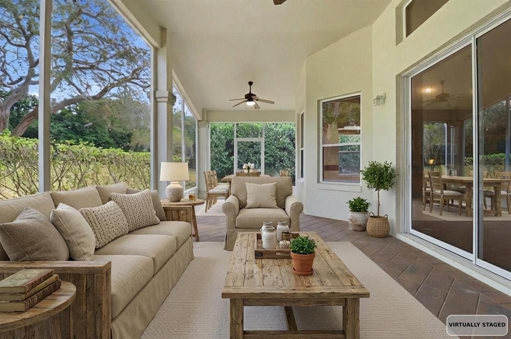 1683 North Shadowview Path Hernando, FL 34442 - Photo 40 of 56 a living room with furniture large windows and wooden floor