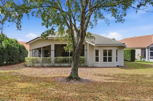 an aerial view of a house with outdoor space