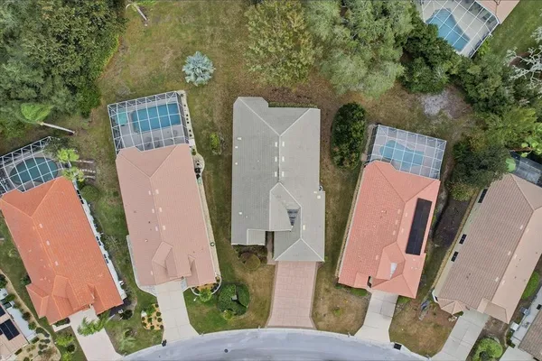 an aerial view of a house with outdoor space