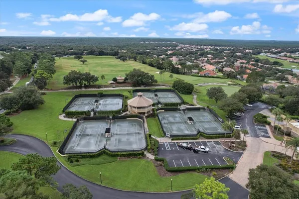 an aerial view of residential houses with outdoor space and river