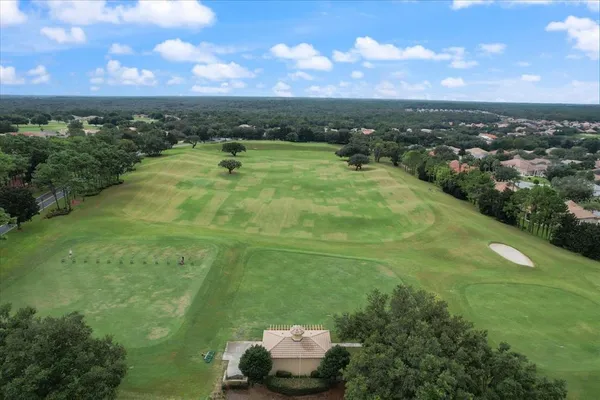 an aerial view of a house with a swimming pool