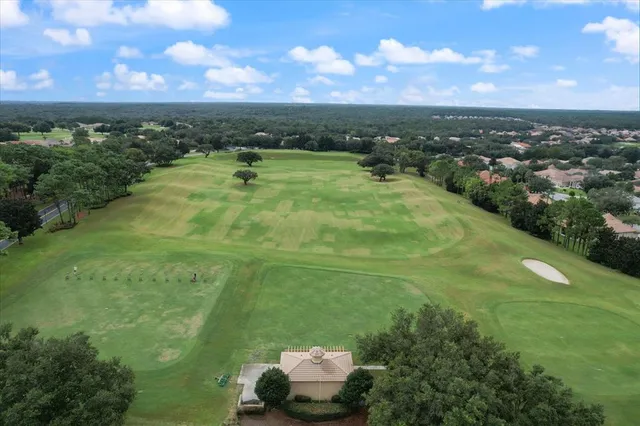 an aerial view of a house with a swimming pool