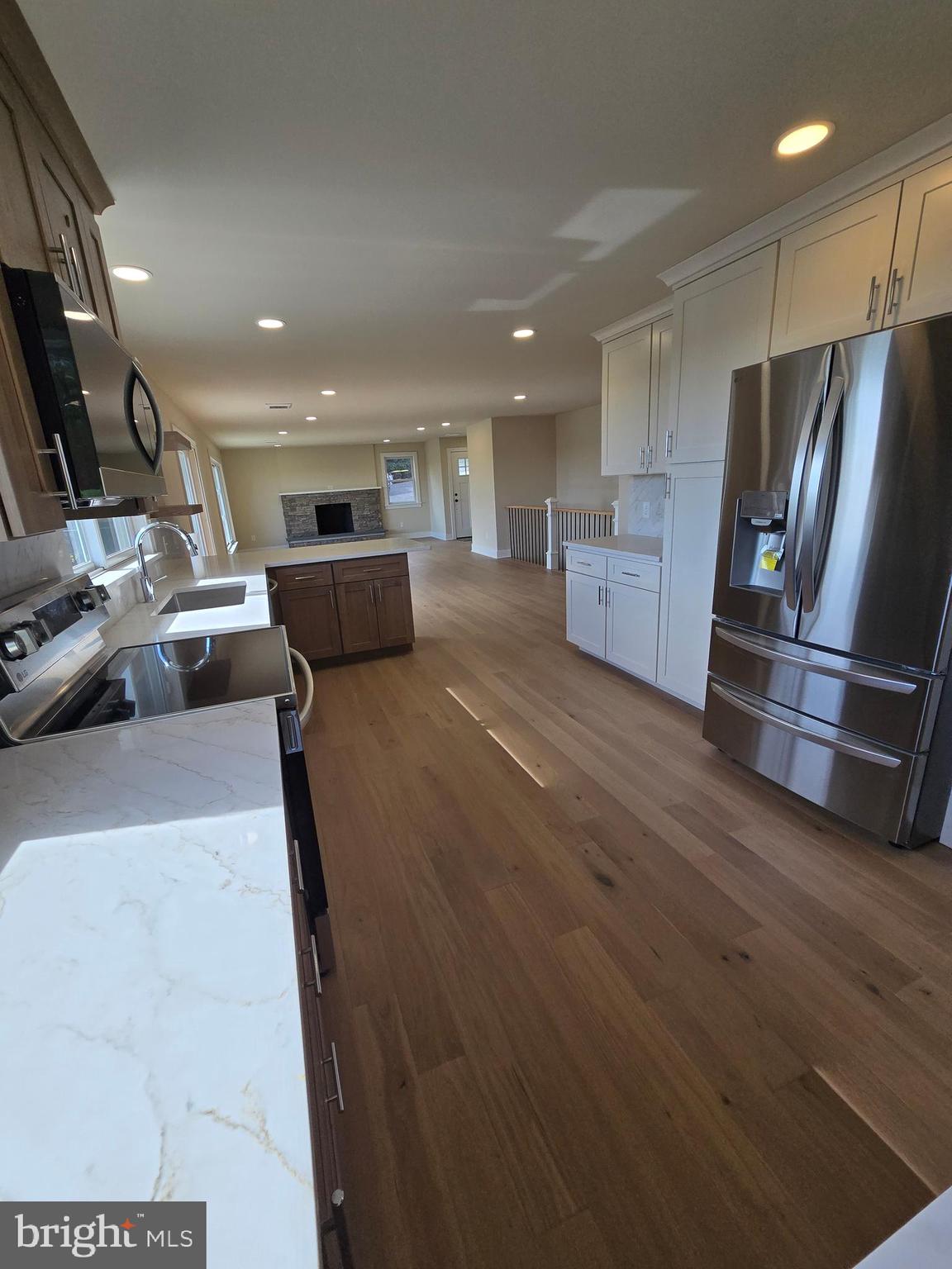873 Ferry Road Doylestown, PA 18901 - Photo 13 of 38 a view of kitchen with stainless steel appliances refrigerator oven and wooden floor