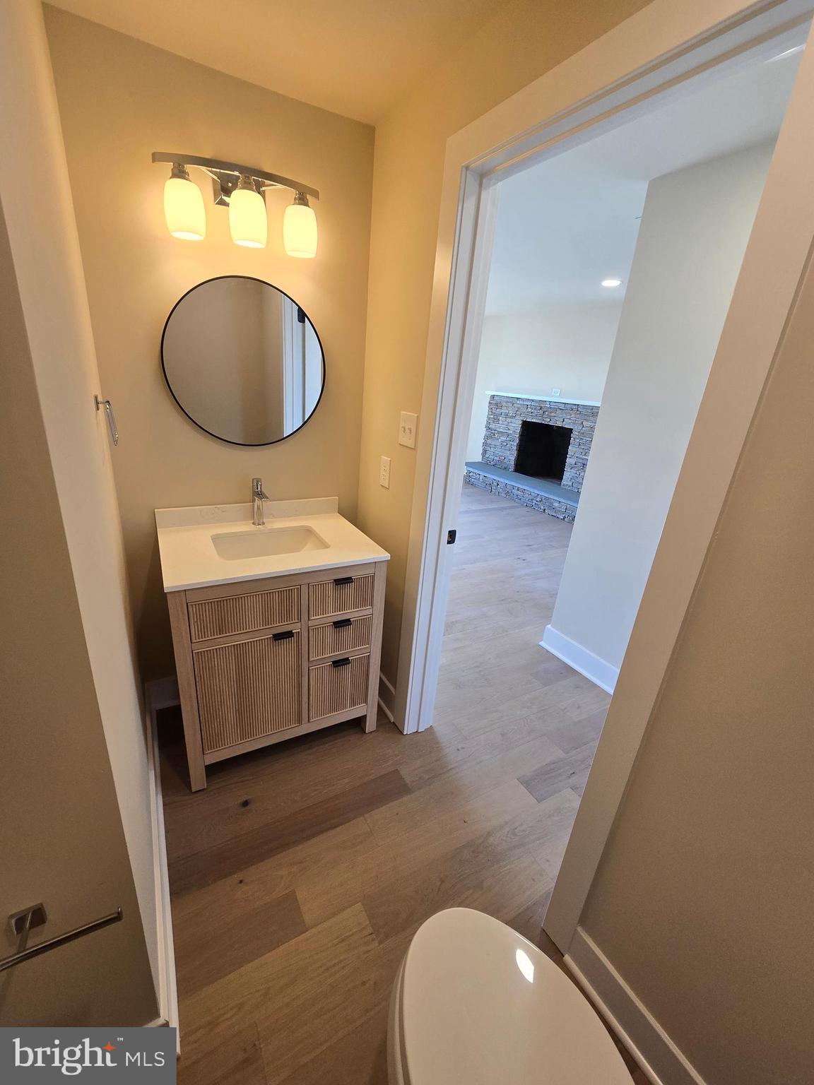873 Ferry Road Doylestown, PA 18901 - Photo 17 of 38 a bathroom with a toilet mirror vanity and sink