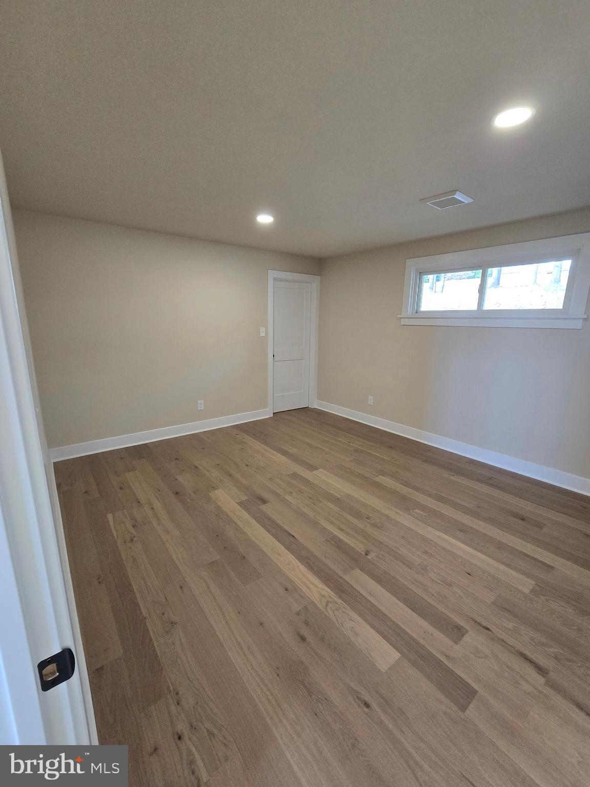 873 Ferry Road Doylestown, PA 18901 - Photo 20 of 38 an empty room with wooden floor and windows