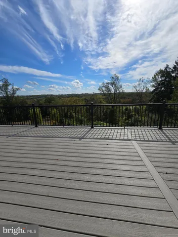 a view of a house with a yard and street view