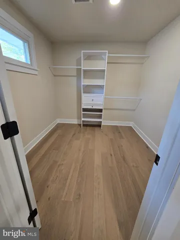 a bathroom with double vanity sink and mirror