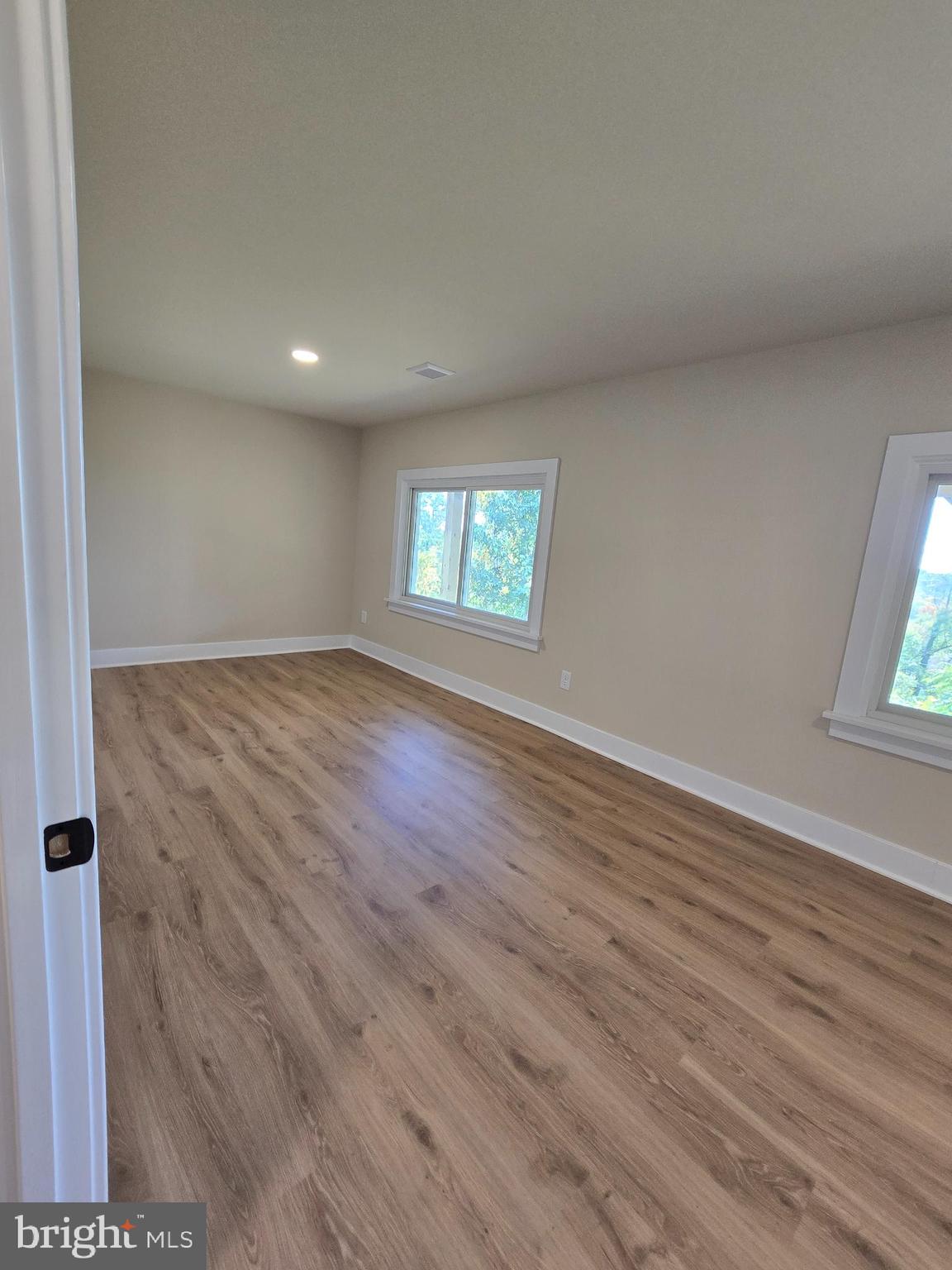 873 Ferry Road Doylestown, PA 18901 - Photo 33 of 38 an empty room with wooden floor and windows