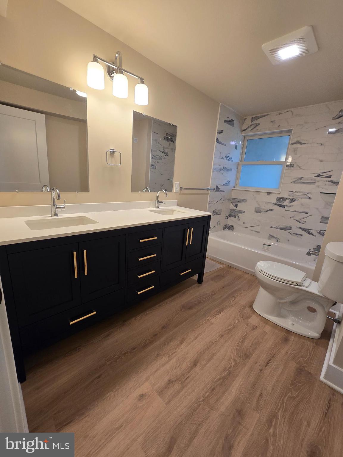 873 Ferry Road Doylestown, PA 18901 - Photo 36 of 38 a spacious bathroom with a double vanity sink and a mirror
