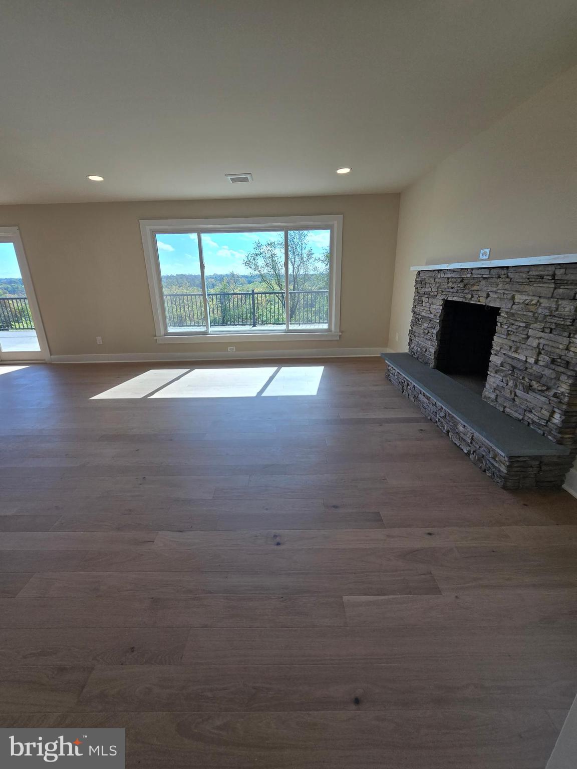 873 Ferry Road Doylestown, PA 18901 - Photo 6 of 38 a view of empty room with wooden floor and fireplace