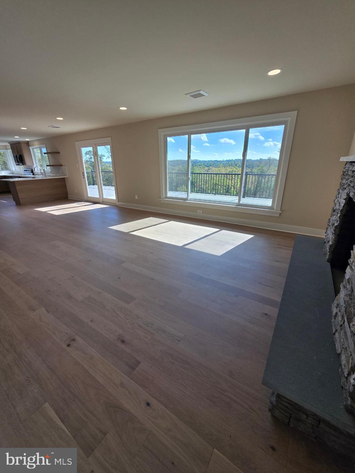 873 Ferry Road Doylestown, PA 18901 - Photo 7 of 38 an empty room with wooden floor and windows