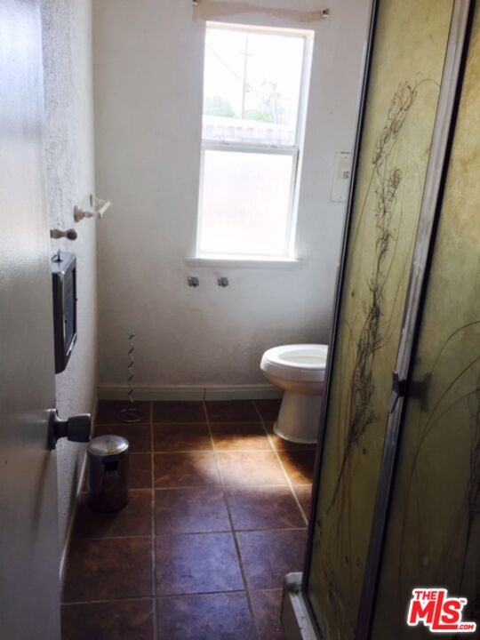 Fort Tejon Road Palmdale, CA 93552 - Photo 21 of 34 a bathroom with a sink a toilet and a window