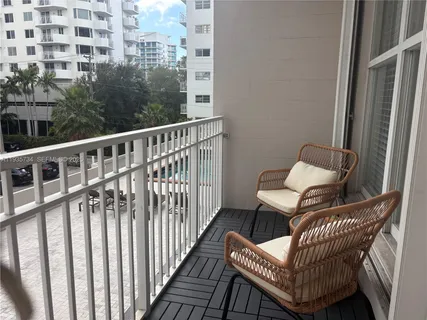 a view of a balcony with chair