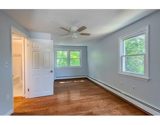 6 Robin Road Billerica, MA 01821 - Photo 15 of 26 a view of an empty room with wooden floor and a window