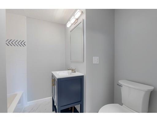 6 Robin Road Billerica, MA 01821 - Photo 17 of 26 a bathroom with a sink vanity and a toilet