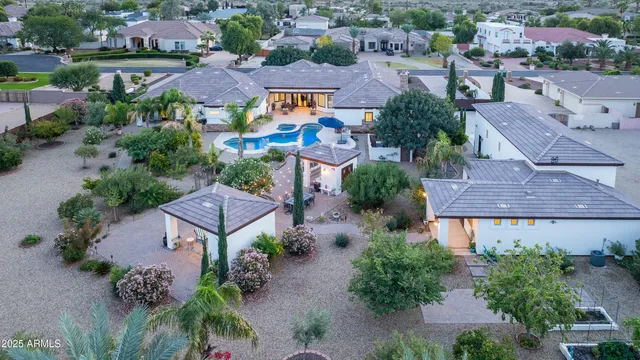 a view of a street with a house in the background