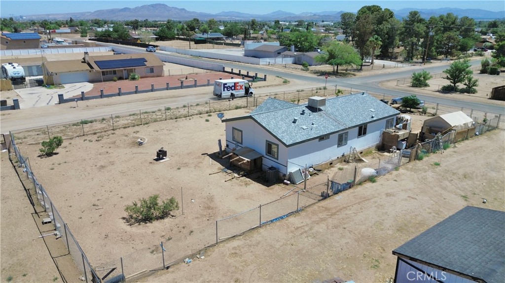 13376 Pacoima Road Victorville, CA 92392 - Photo 5 of 11 an aerial view of a house with a garden