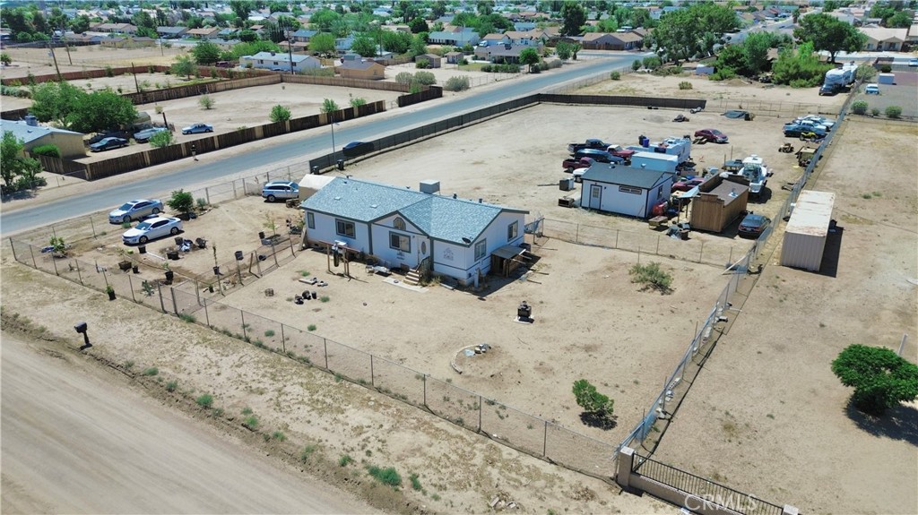 13376 Pacoima Road Victorville, CA 92392 - Photo 7 of 11 an aerial view of a house with a yard
