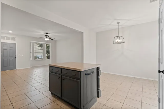 a kitchen with stainless steel appliances granite countertop a sink and a stove