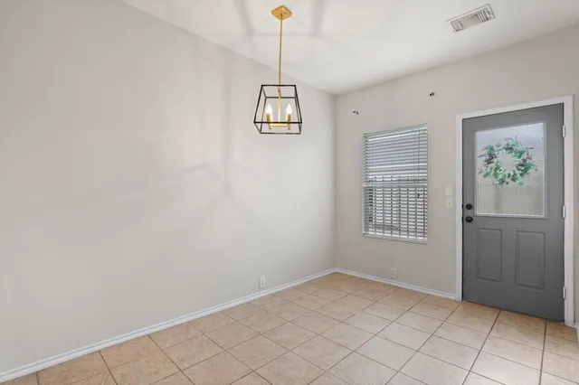 a view of an empty room with window