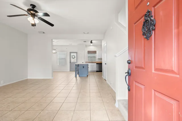 a view of a entryway with a ceiling fan