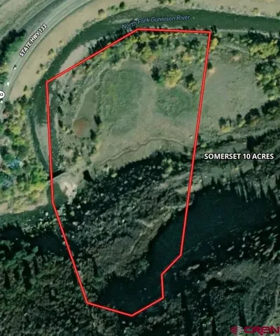 an aerial view of a residential houses with outdoor space