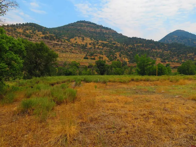 a view of a town with mountains in the background