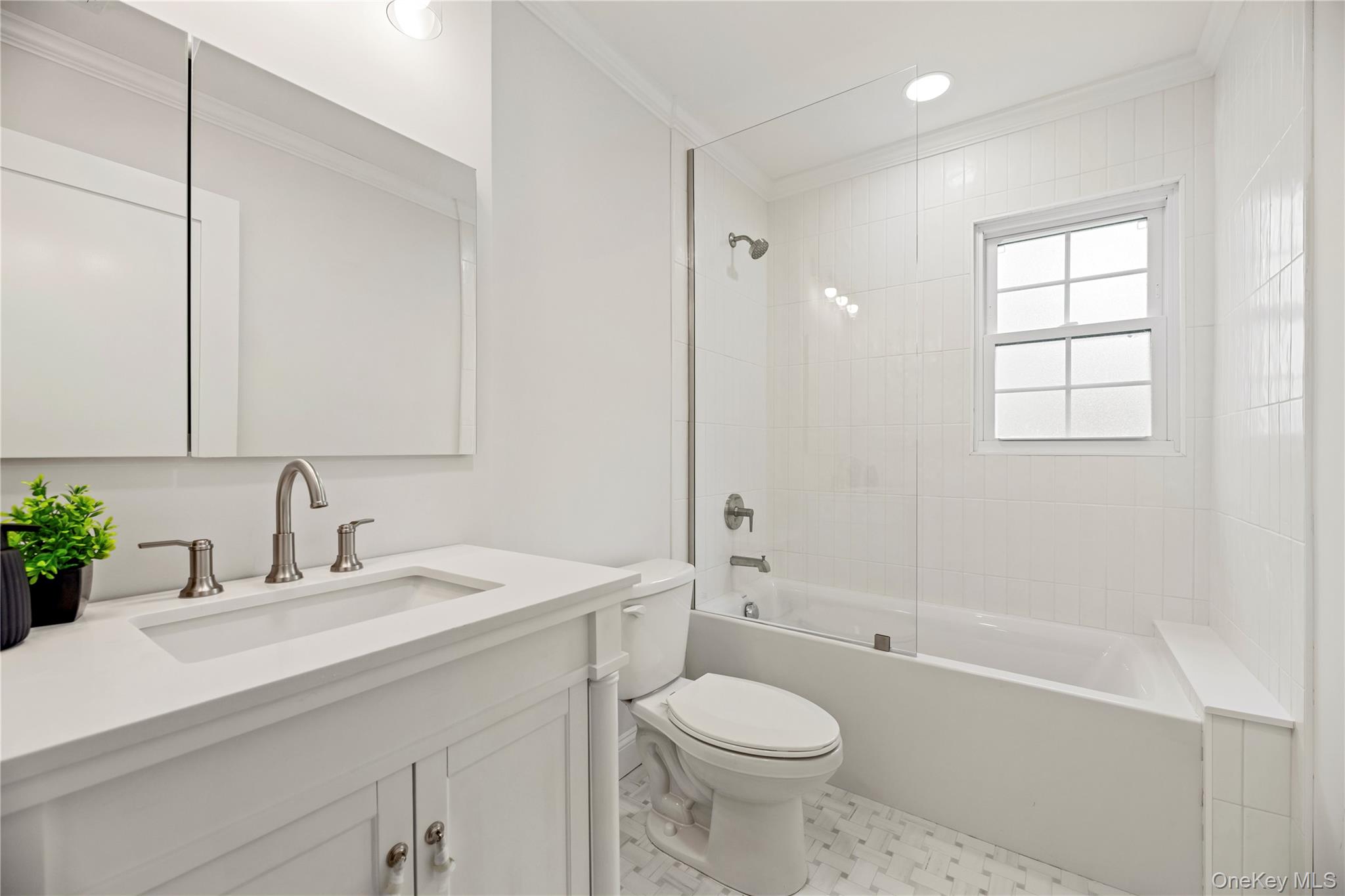 16 Eleanor Road Plainview, NY 11803 - Photo 13 of 28 New Bathroom featuring a white vanity with integrated sink, brushed nickel faucet, and a wall-mounted medicine cabinet