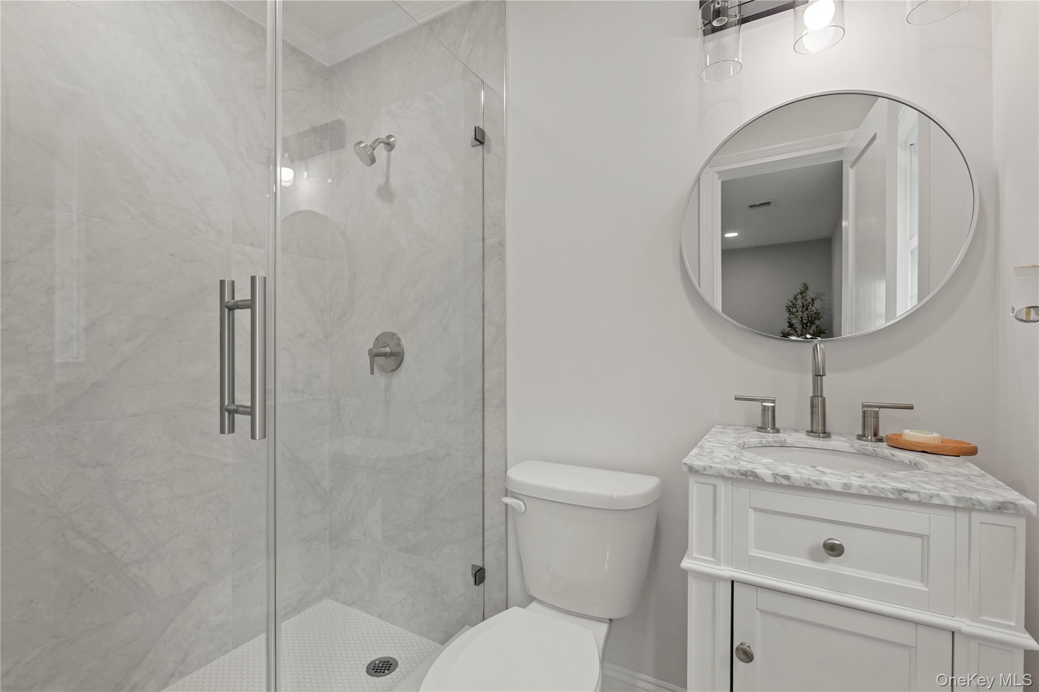 16 Eleanor Road Plainview, NY 11803 - Photo 18 of 28 Modern bathroom featuring a glass-enclosed shower